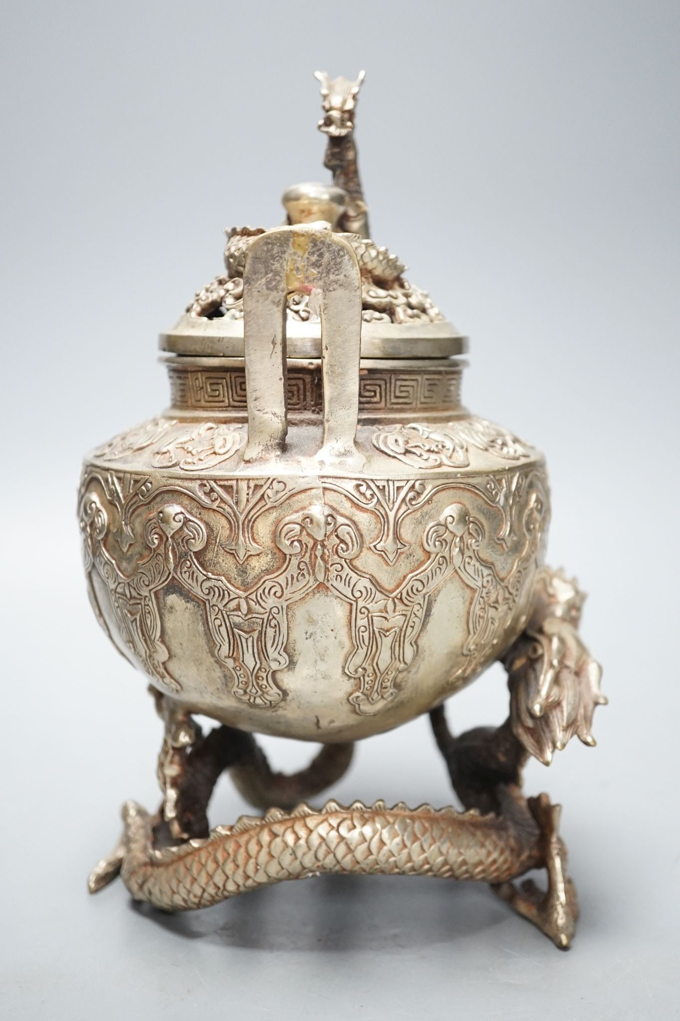 A Chinese bronze 'dragon' censer and cover, 24.5 cms high